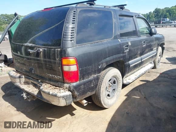 2003 Chevrolet Tahoe LS with VIN 1GNEC13V53R214113, listed as a IAAI auction lot 42880317 with 264,509 mi miles and . Bid and sale history available at DreamBid. Image 4.