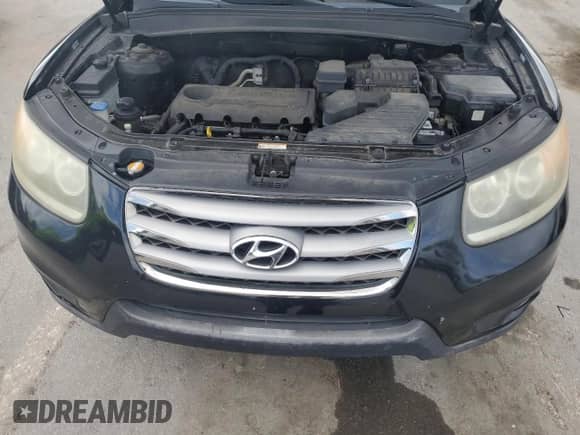 2012 Hyundai Santa Fe Limited z VIN 5XYZK3AB8CG125653, wystawiony jako Copart lot #81908775 z przebiegiem 209 217 mil mil oraz Czysty tytuł • Clean title. Historia ofert i sprzedaży dostępna na DreamBid. Obrazek 12.