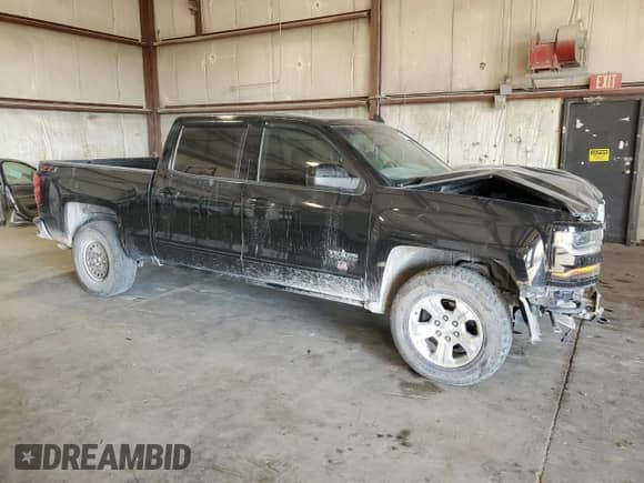 2018 Chevrolet Silverado 1500 LT z VIN 3GCUKREC9JG213996, wystawiony jako Copart lot #70379115 z przebiegiem 104 786 mil mil oraz Szkoda całkowita • Salvage title. Historia ofert i sprzedaży dostępna na DreamBid. Obrazek 4.