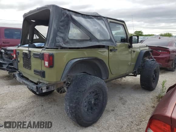 2013 Jeep Wrangler Rubicon with VIN 1C4HJWCG1DL574039, listed as a Copart auction lot 48728645 with 116,537 mi miles and Salvage title. Bid and sale history available at DreamBid. Image 3.