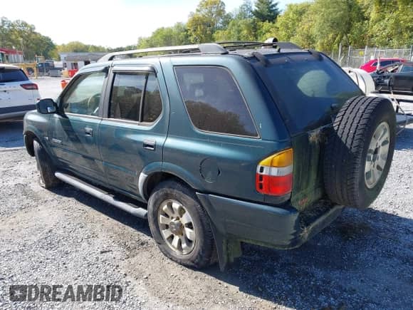 1998 Honda Passport LX z VIN 4S6CM58W2W4404123, wystawiony jako IAAI lot #43346823 z przebiegiem 167 991 mil mil oraz . Historia ofert i sprzedaży dostępna na DreamBid. Obrazek 3.