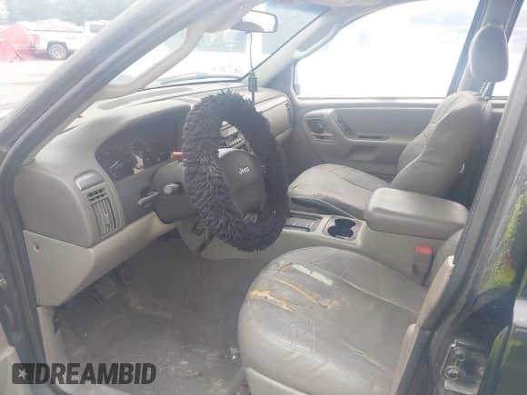 2004 Jeep Grand Cherokee Laredo z VIN 1J4GW48S94C334648, wystawiony jako IAAI lot #42979256 z przebiegiem 155 411 mil mil oraz . Historia ofert i sprzedaży dostępna na DreamBid. Obrazek 5.