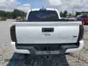 2018 Toyota Tacoma SR with VIN 5TFCZ5ANXJX162902, listed as a Copart auction lot 68464895 with 105,750 mi miles and Salvage title. Bid and sale history available at DreamBid. Image 6.