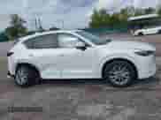 2024 Mazda CX-5 S Preferred z VIN JM3KFBCL3R0456491, wystawiony jako IAAI lot #43289902 z przebiegiem 20 370 mil mil oraz . Historia ofert i sprzedaży dostępna na DreamBid. Obrazek 13.