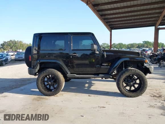 2014 Jeep Wrangler Sahara with VIN 1C4AJWBG6EL304907, listed as a IAAI auction lot 42007310 with 53,277 mi miles and . Bid and sale history available at DreamBid. Image 12.