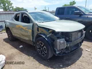 2023 Hyundai Santa Cruz SEL Premium z VIN 5NTJDDAF1PH051282, wystawiony jako IAAI lot #42725019 z przebiegiem 70 082 mil mil oraz . Historia ofert i sprzedaży dostępna na DreamBid. Obrazek 1.