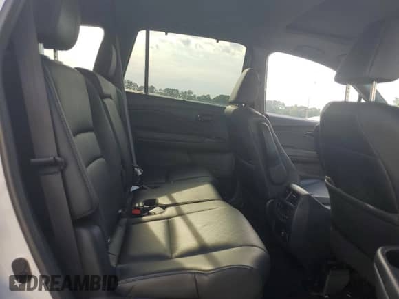 2023 Honda Passport Elite with VIN 5FNYF8H09PB007934, listed as a Copart auction lot 57076135 with 50,650 mi miles and Salvage title. Bid and sale history available at DreamBid. Image 11.