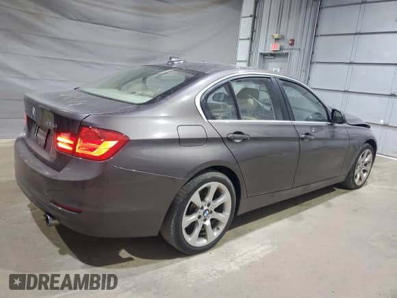 2015 BMW 3 Series 335i xDrive with VIN WBA3B9G57FNR99402, listed as a Copart auction lot 70015545 with 127,455 mi miles and Salvage title. Bid and sale history available at DreamBid. Image 3.