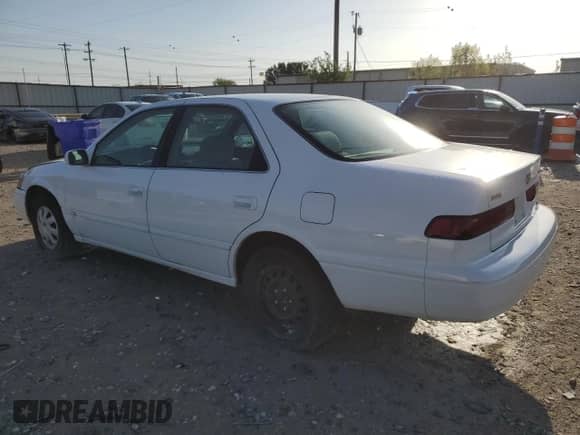 1999 Toyota Camry LE z VIN JT2BG22K4X0378940, wystawiony jako Copart lot #69477874 z przebiegiem 255 052 mil mil oraz Szkoda całkowita • Salvage title. Historia ofert i sprzedaży dostępna na DreamBid. Obrazek 2.