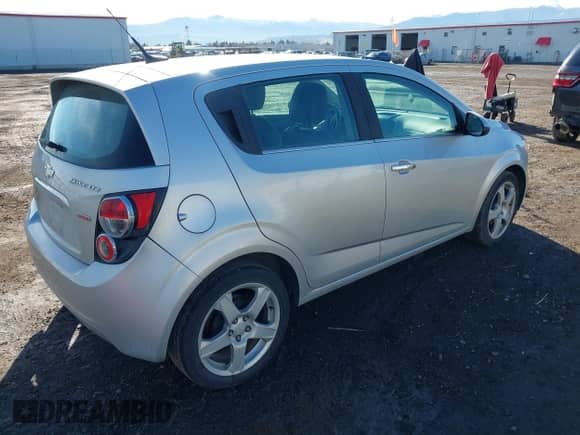 2013 Chevrolet Sonic LTZ with VIN 1G1JE6SB2D4104651, listed as a IAAI auction lot 41803945 with 132,337 mi miles and . Bid and sale history available at DreamBid. Image 4.