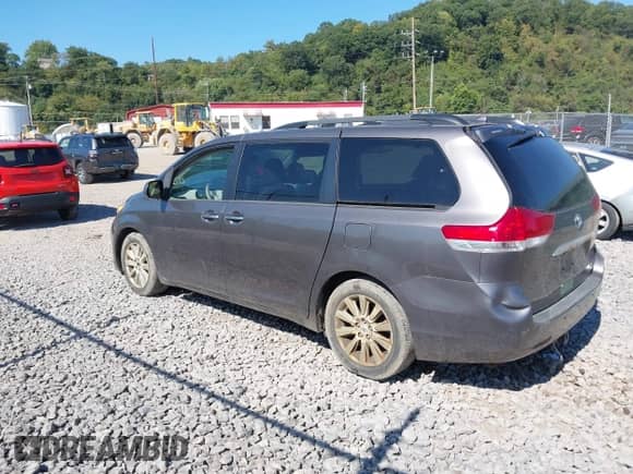 2012 Toyota Sienna XLE with VIN 5TDDK3DC1CS045290, listed as a IAAI auction lot 43145985 with 212,749 mi miles and . Bid and sale history available at DreamBid. Image 3.