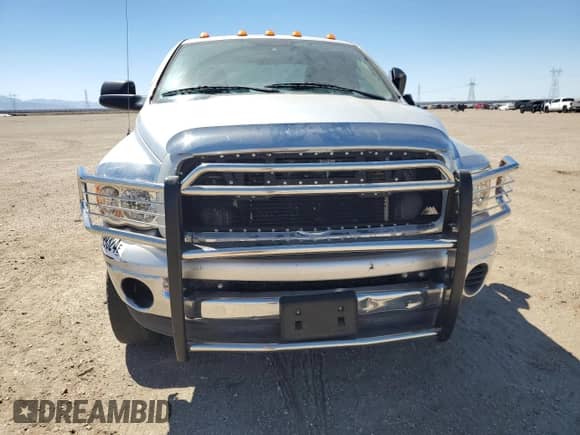 2004 Dodge 3500 SLT with VIN 3D7MU48614G158487, listed as a Copart auction lot 69199324 with 122,891 mi miles and Salvage title. Bid and sale history available at DreamBid. Image 5.