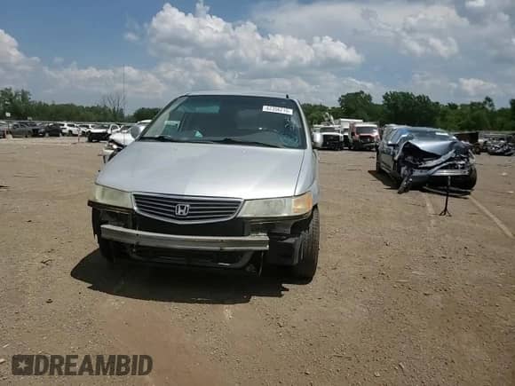 2001 Honda Odyssey LX с VIN 2HKRL185X1H616779, выставлен на аукционе Copart как лот 62356215 с пробегом Не указан миль и Списание • Salvage title. История ставок и продаж доступна на DreamBid. Изображение 14.