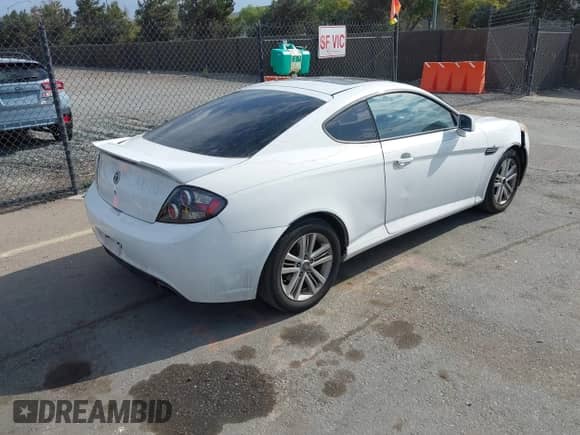 2007 Hyundai Tiburon GS with VIN KMHHM66D47U254751, listed as a IAAI auction lot 43124714 with 206,292 mi miles and . Bid and sale history available at DreamBid. Image 4.