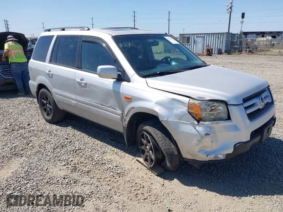 2006 Honda Pilot EX-L z VIN 2HKYF18606H511736, wystawiony jako IAAI lot #42731682 z przebiegiem 142 934 mil mil oraz . Historia ofert i sprzedaży dostępna na DreamBid. Obrazek 1.
