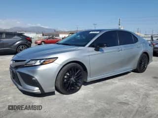 2022 Toyota Camry Hybrid XSE с VIN 4T1K31AK0NU044226, выставлен на аукционе Copart как лот 70329195 с пробегом 59 984 миль миль и Чистый • Clean title. История ставок и продаж доступна на DreamBid. Изображение 1.