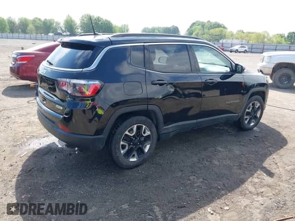 2021 Jeep Compass Altitude with VIN 3C4NJCBB0MT502423, listed as a IAAI auction lot 42006742 with 63,418 mi miles and . Bid and sale history available at DreamBid. Image 4.