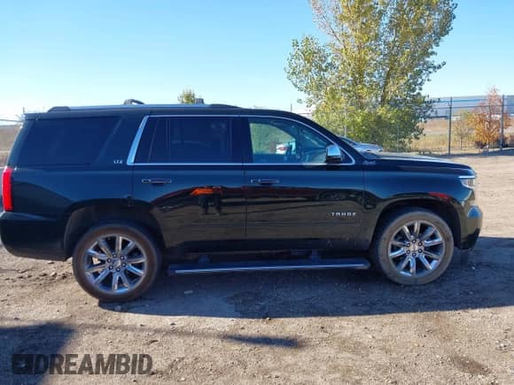 2016 Chevrolet Tahoe LTZ with VIN 1GNSKCKC7GR356857, listed as a IAAI auction lot 43515148 with 159,145 mi miles and . Bid and sale history available at DreamBid. Image 13.