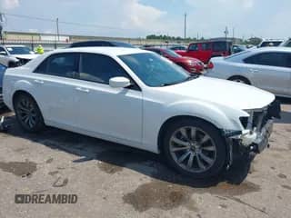 2014 Chrysler 300 S with VIN 2C3CCABT3EH276200, listed as a IAAI auction lot 43015483 with 112,424 mi miles and . Bid and sale history available at DreamBid. Image 1.