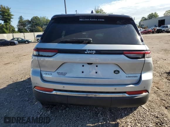 2023 Jeep Grand Cherokee Laredo with VIN 1C4RJHAG0P8710302, listed as a Copart auction lot 70679365 with 67,832 mi miles and Salvage title. Bid and sale history available at DreamBid. Image 6.