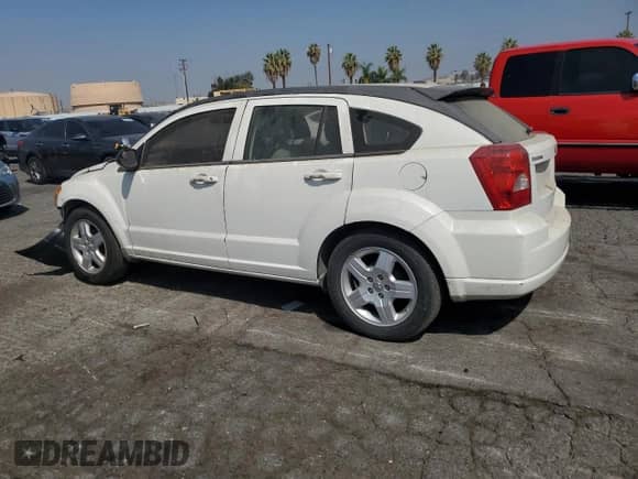 2009 Dodge Caliber SXT with VIN 1B3HB48A89D132433, listed as a Copart auction lot 67794985 with 149,985 mi miles and Salvage title. Bid and sale history available at DreamBid. Image 2.