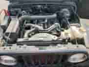 2003 Jeep Wrangler X z VIN 1J4FA39S23P359983, wystawiony jako Copart lot #59469005 z przebiegiem 118 585 mil mil oraz Czysty tytuł • Clean title. Historia ofert i sprzedaży dostępna na DreamBid. Obrazek 12.