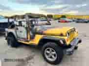 2000 Jeep Wrangler SE with VIN 1J4FA29P9YP787126, listed as a Copart auction lot 69889405 with Not provided miles and Non repairable. Bid and sale history available at DreamBid. Image 4.