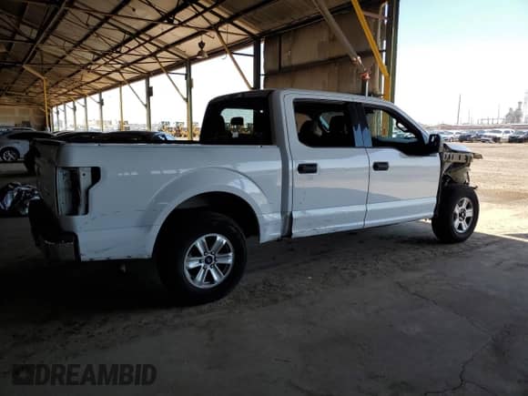 2020 Ford F-150 XL with VIN 1FTEW1C45LKD11814, listed as a Copart auction lot 69002595 with 106,500 mi miles and Salvage title. Bid and sale history available at DreamBid. Image 3.