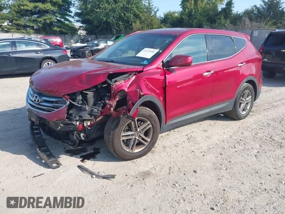 2018 Hyundai Santa Fe 2.4L z VIN 5XYZTDLB2JG556213, wystawiony jako IAAI lot #43272986 z przebiegiem 105 475 mil mil oraz . Historia ofert i sprzedaży dostępna na DreamBid. Obrazek 2.