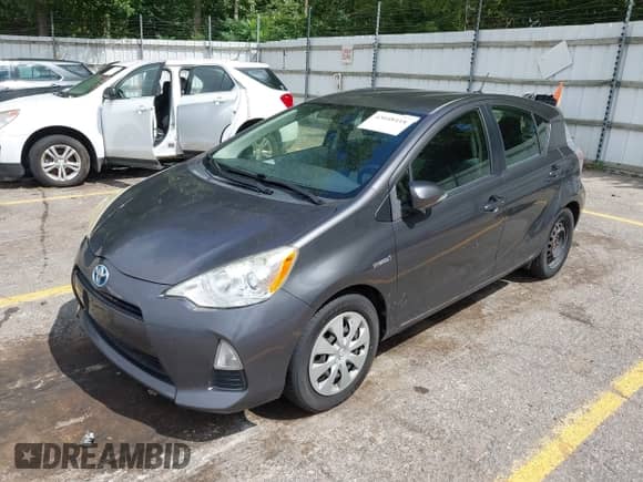 2014 Toyota Prius One with VIN JTDKDTB38E1562235, listed as a IAAI auction lot 43048418 with 164,639 mi miles and . Bid and sale history available at DreamBid. Image 2.