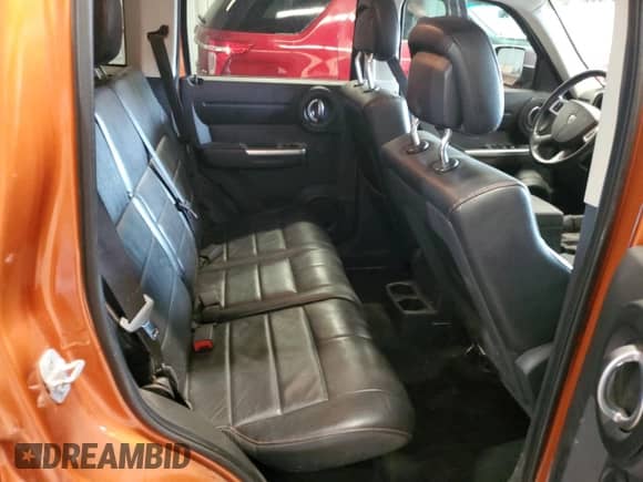 2011 Dodge Nitro Shock z VIN 1D4PU7GX8BW590952, wystawiony jako Copart lot #64893755 z przebiegiem 135 449 mil mil oraz Szkoda całkowita • Salvage title. Historia ofert i sprzedaży dostępna na DreamBid. Obrazek 11.