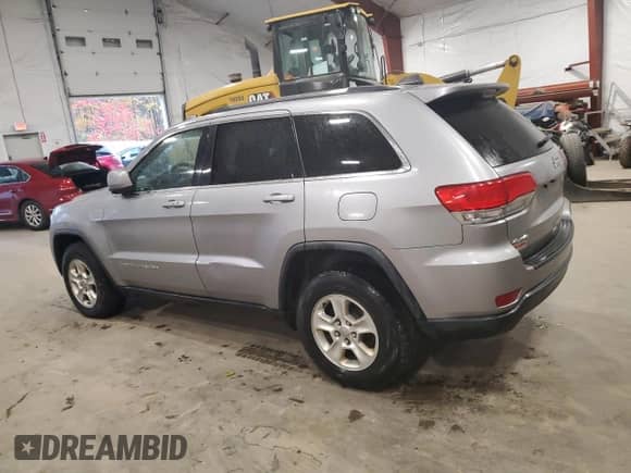 2016 Jeep Grand Cherokee Laredo with VIN 1C4RJFAG7GC420415, listed as a Copart auction lot 82528725 with 160,174 mi miles and Clean title. Bid and sale history available at DreamBid. Image 2.