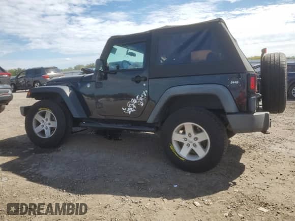 2010 Jeep Wrangler Sport с VIN 1J4AA2D13AL111104, выставлен на аукционе Copart как лот 84287605 с пробегом 110 407 миль миль и Списание • Salvage title. История ставок и продаж доступна на DreamBid. Изображение 2.