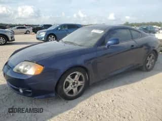 2003 Hyundai Tiburon with VIN KMHHM65D03U095741, listed as a Copart auction lot 55147305 with 170,946 mi miles and Salvage title. Bid and sale history available at DreamBid. Image 1.