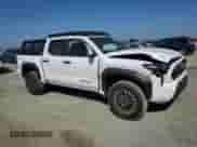 2024 Toyota Tacoma SR5 with VIN 3TMLB5JN4RM050957, listed as a Copart auction lot 71130595 with 1,873 mi miles and Salvage title. Bid and sale history available at DreamBid. Image 4.