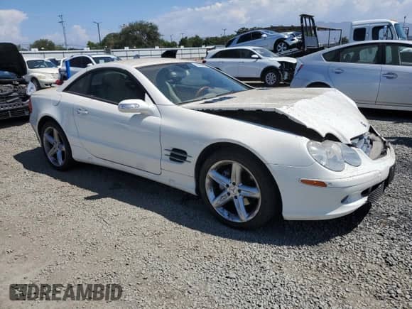 2006 Mercedes-Benz SL 500 with VIN WDBSK75F16F114912, listed as a Copart auction lot 69154055 with 128,783 mi miles and Salvage title. Bid and sale history available at DreamBid. Image 4.