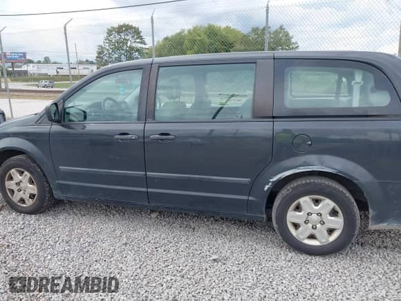 2012 Dodge Grand Caravan SE z VIN 2C4RDGBG9CR285810, wystawiony jako IAAI lot #43317721 z przebiegiem 162 753 mil mil oraz . Historia ofert i sprzedaży dostępna na DreamBid. Obrazek 6.