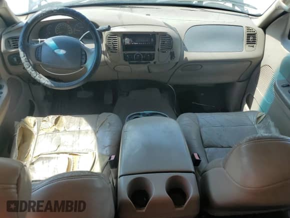 2002 Ford F-150 XLT с VIN 1FTRW07L22KB04146, выставлен на аукционе Copart как лот 69320515 с пробегом 189 839 миль миль и Списание • Salvage title. История ставок и продаж доступна на DreamBid. Изображение 8.