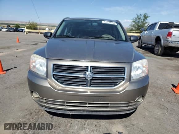 2007 Dodge Caliber SXT with VIN 1B3HB48B57D203433, listed as a Copart auction lot 67139005 with 123,601 mi miles and Salvage title. Bid and sale history available at DreamBid. Image 5.