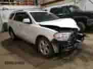 2013 Dodge Durango Crew with VIN 1C4RDJDG9DC554196, listed as a Copart auction lot 80313895 with 104,486 mi miles and Salvage title. Bid and sale history available at DreamBid. Image 4.