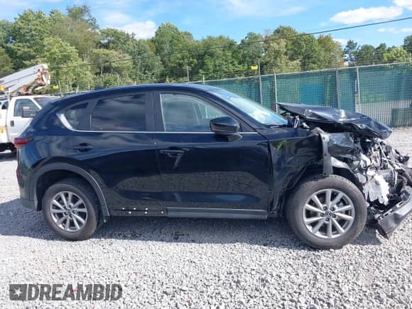 2023 Mazda CX-5 S Select with VIN JM3KFBBM9P0242998, listed as a IAAI auction lot 43071605 with 20,060 mi miles and . Bid and sale history available at DreamBid. Image 13.
