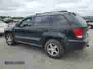 2007 Jeep Grand Cherokee Laredo with VIN 1J8GR48K87C650696, listed as a Copart auction lot 64183655 with 151,903 mi miles and Non repairable. Bid and sale history available at DreamBid. Image 2.