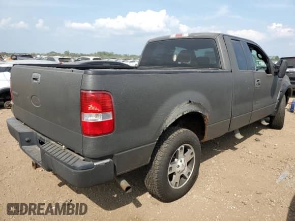 2005 Ford F-150 XLT with VIN 1FTPX14515FB15779, listed as a Copart auction lot 67227375 with 186,942 mi miles and Salvage title. Bid and sale history available at DreamBid. Image 3.