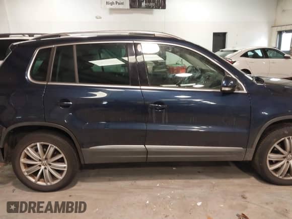 2014 Volkswagen Tiguan SEL with VIN WVGAV3AX8EW563008, listed as a IAAI auction lot 41356523 with 138,211 mi miles and . Bid and sale history available at DreamBid. Image 13.