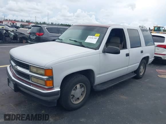 1999 Chevrolet Tahoe with VIN 1GNEC13RXXJ303585, listed as a IAAI auction lot 43151795 with 173,900 mi miles and . Bid and sale history available at DreamBid. Image 2.