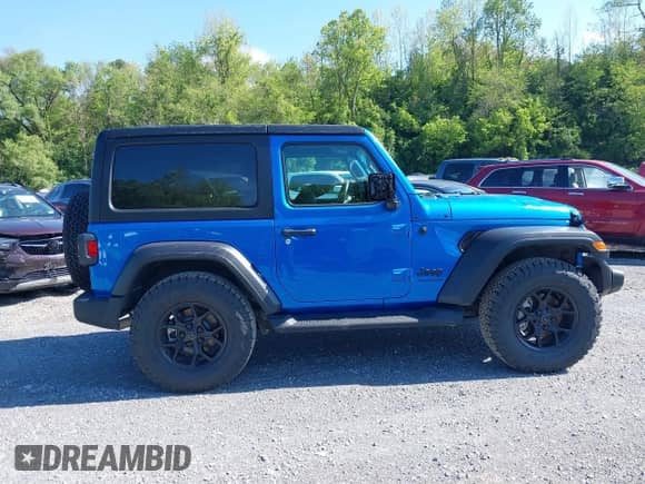 2022 Jeep Wrangler Sport S with VIN 1C4GJXAG0NW145642, listed as a IAAI auction lot 42112670 with 8,737 mi miles and . Bid and sale history available at DreamBid. Image 13.