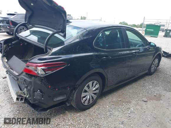 2022 Toyota Camry Hybrid LE with VIN 4T1C31AK3NU574937, listed as a IAAI auction lot 43038140 with 50,708 mi miles and . Bid and sale history available at DreamBid. Image 4.