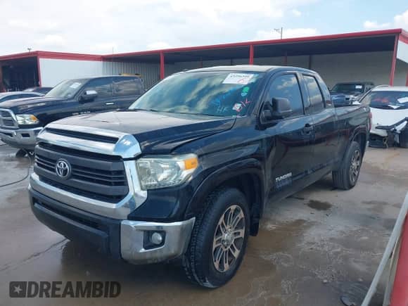 2014 Toyota Tundra SR with VIN 5TFRM5F11EX080643, listed as a IAAI auction lot 43296399 with 247,504 mi miles and . Bid and sale history available at DreamBid. Image 2.