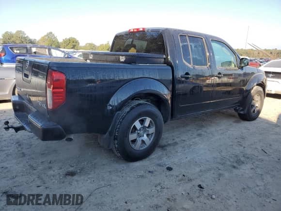 2010 Nissan Frontier LE with VIN 1N6AD0EV1AC407478, listed as a Copart auction lot 82302504 with 146,560 mi miles and Salvage title. Bid and sale history available at DreamBid. Image 3.