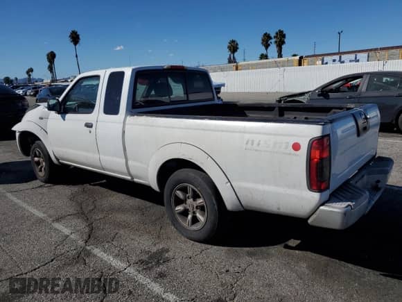 2002 Nissan Frontier XE with VIN 1N6DD26S02C336451, listed as a Copart auction lot 82412035 with 250,739 mi miles and Salvage title. Bid and sale history available at DreamBid. Image 2.